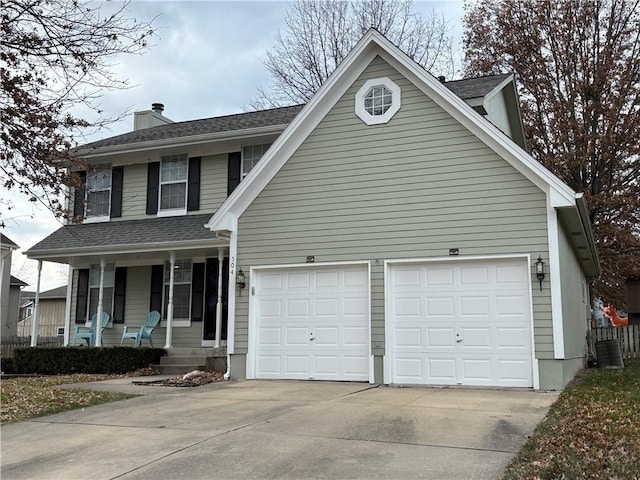 view of front of home with covered porch and a garage