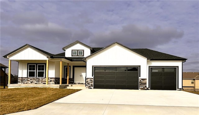 view of front of home featuring a garage and covered porch