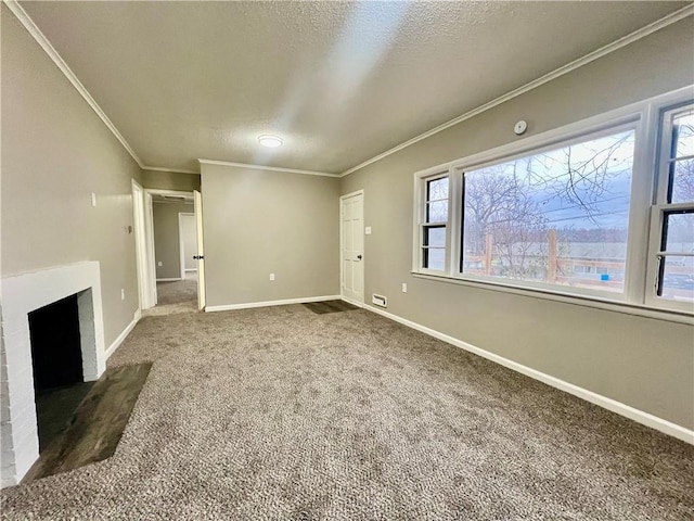 unfurnished living room featuring crown molding, a fireplace, a healthy amount of sunlight, and dark colored carpet