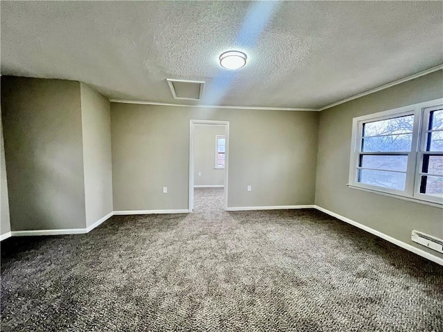 spare room featuring carpet flooring, a baseboard heating unit, a textured ceiling, and ornamental molding