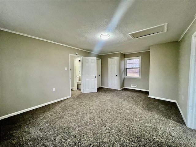 unfurnished bedroom featuring carpet floors, a textured ceiling, and ornamental molding