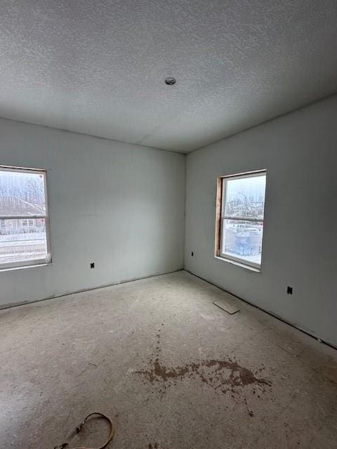 empty room with a textured ceiling