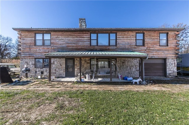 back of house featuring stone siding, metal roof, a chimney, and log siding