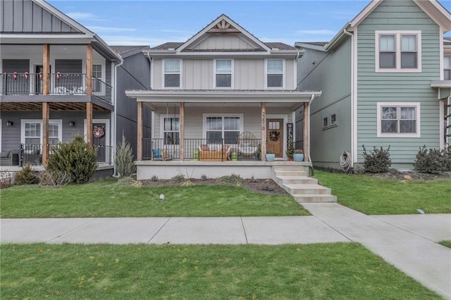 townhome / multi-family property featuring covered porch