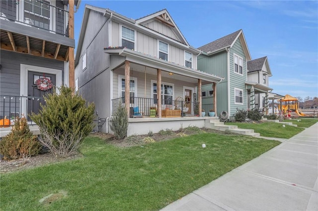 view of front facade with a porch and a front lawn