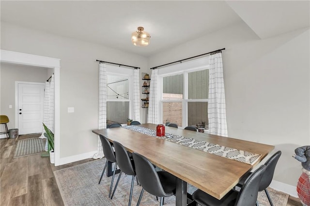 dining space with hardwood / wood-style floors