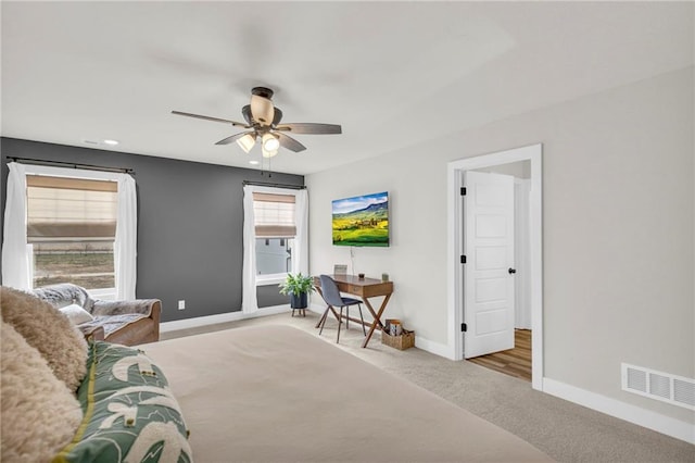 sitting room with light carpet and ceiling fan