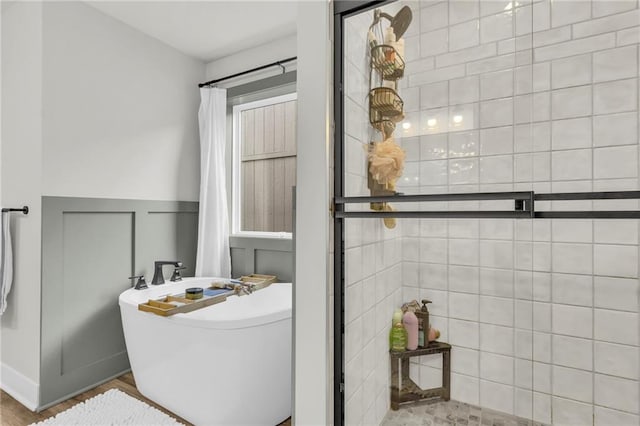 bathroom with separate shower and tub