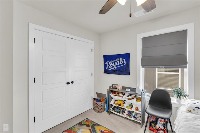 interior space with ceiling fan