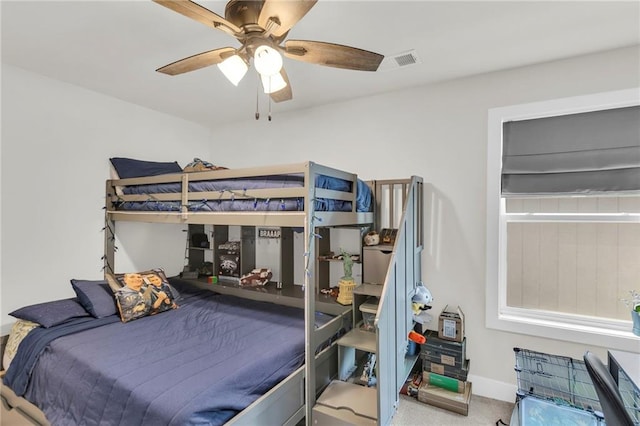 bedroom with ceiling fan and carpet floors