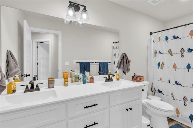 bathroom featuring hardwood / wood-style flooring, vanity, curtained shower, and toilet