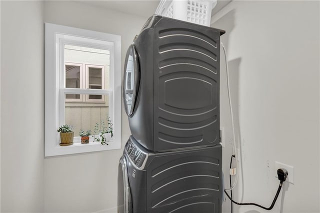 laundry room featuring stacked washer / dryer