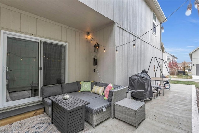 wooden terrace featuring outdoor lounge area and a patio area