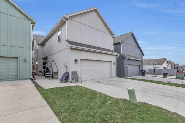 view of property exterior featuring a garage and a lawn