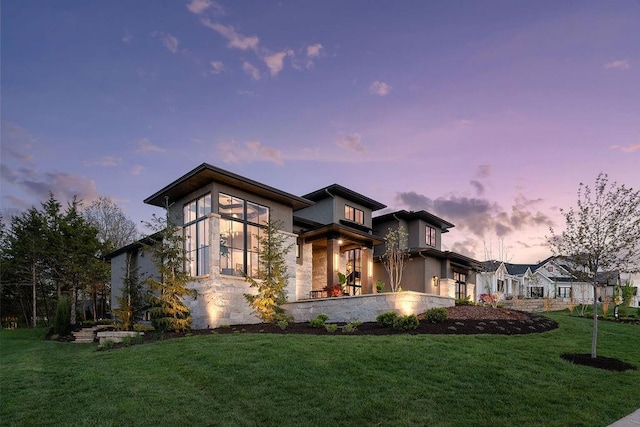 21359 W 93rd Ct, Lenexa, KS 66220 - view of front of house with stone siding, a yard, and stucco siding