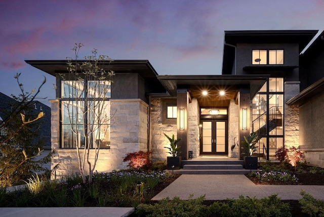 21359 W 93rd Ct, Lenexa, KS 66220 - entrance to property with french doors and stone siding
