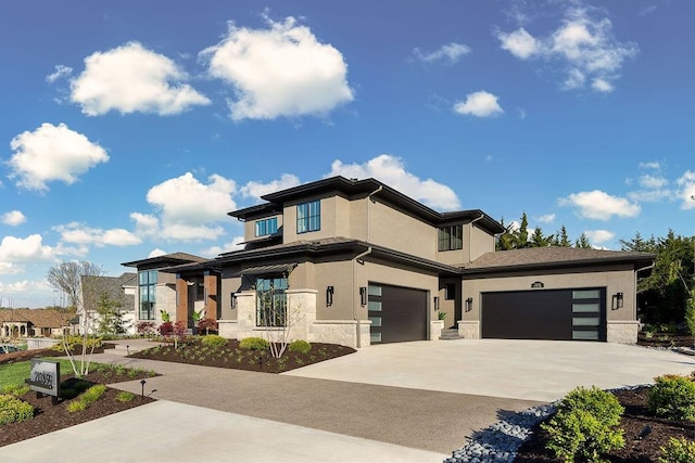 21359 W 93rd Ct, Lenexa, KS 66220 - prairie-style home featuring driveway, stucco siding, stone siding, and a garage