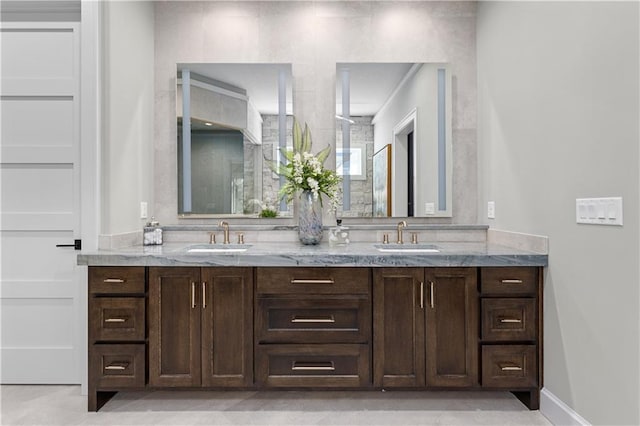 21359 W 93rd Ct, Lenexa, KS 66220 - bathroom featuring double vanity and baseboards