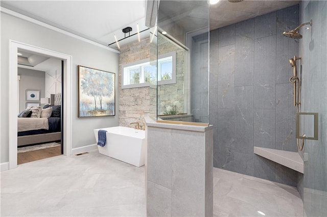 21359 W 93rd Ct, Lenexa, KS 66220 - bathroom with a walk in shower, ensuite bath, a freestanding tub, and baseboards
