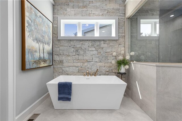 21359 W 93rd Ct, Lenexa, KS 66220 - bathroom featuring a freestanding bath