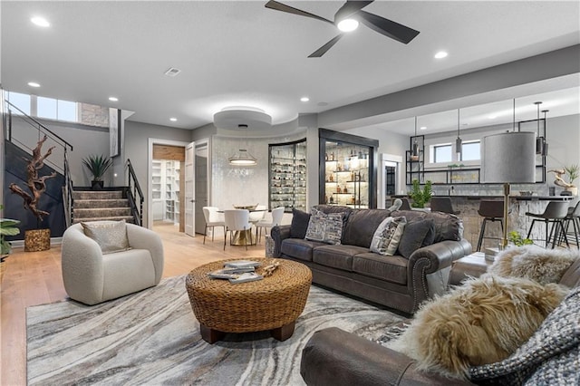 21359 W 93rd Ct, Lenexa, KS 66220 - living area featuring stairway, recessed lighting, wood finished floors, and a ceiling fan