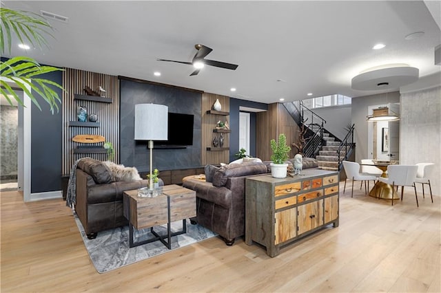 21359 W 93rd Ct, Lenexa, KS 66220 - living room with stairs, a ceiling fan, light wood finished floors, and recessed lighting