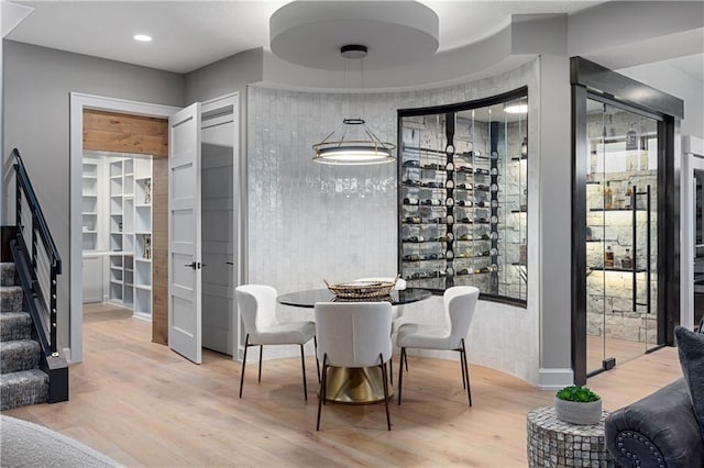 21359 W 93rd Ct, Lenexa, KS 66220 - wine room featuring wood finished floors and healthy amount of natural light