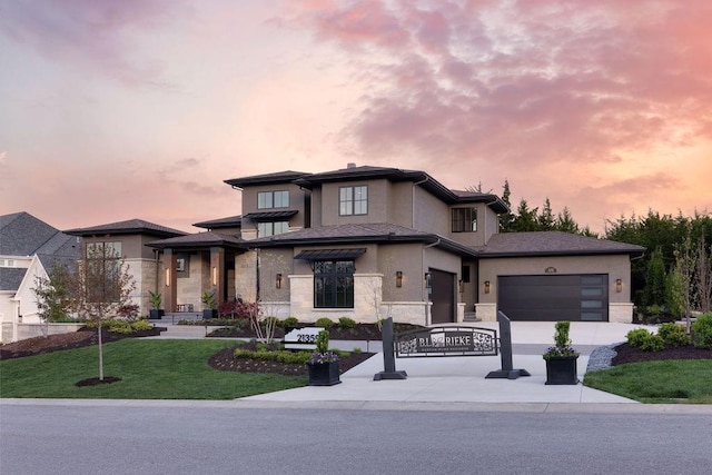 21359 W 93rd Ct, Lenexa, KS 66220 - prairie-style home with stone siding, stucco siding, a front lawn, and a garage