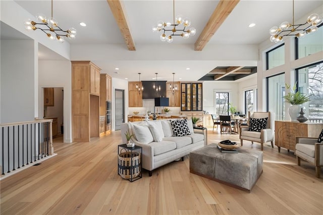 living room with beam ceiling, light hardwood / wood-style flooring, and a notable chandelier