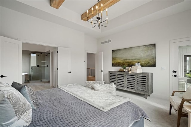 bedroom featuring light carpet, ensuite bath, and a notable chandelier