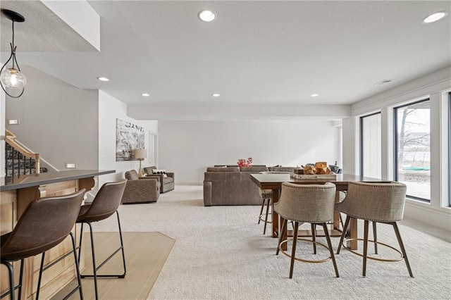 dining room featuring light colored carpet