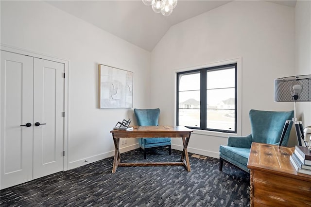 home office featuring vaulted ceiling and a notable chandelier