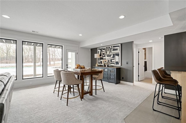 view of carpeted dining space