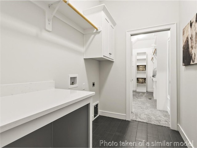 laundry room featuring cabinets, washer hookup, and electric dryer hookup