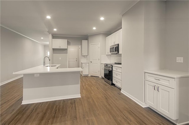 kitchen featuring dark hardwood / wood-style flooring, white cabinetry, and stainless steel appliances