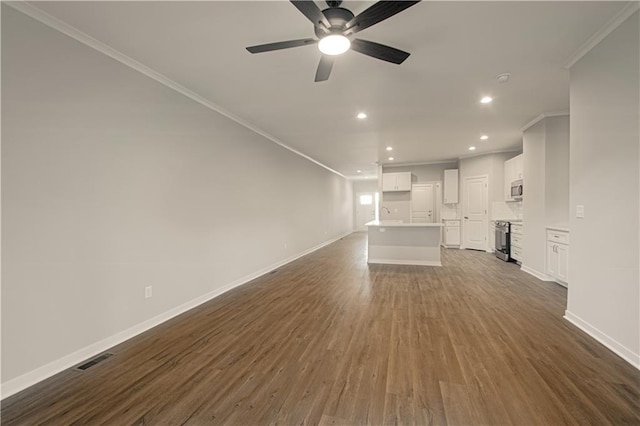 unfurnished living room with crown molding, dark hardwood / wood-style flooring, and ceiling fan