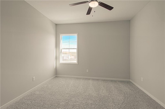 unfurnished room with ceiling fan and carpet floors