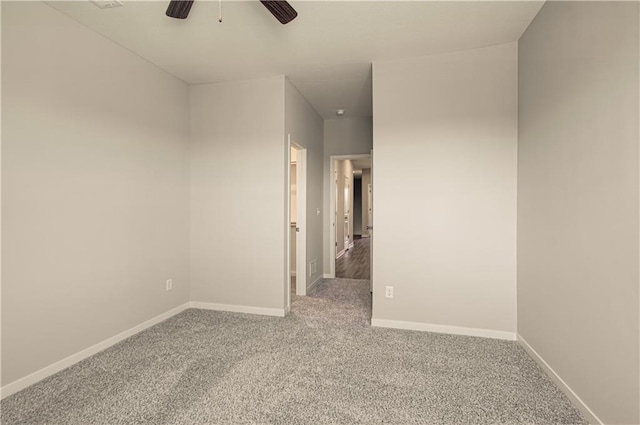 unfurnished room with carpet flooring and ceiling fan