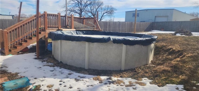 view of snow covered pool