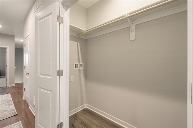 walk in closet featuring dark wood-type flooring