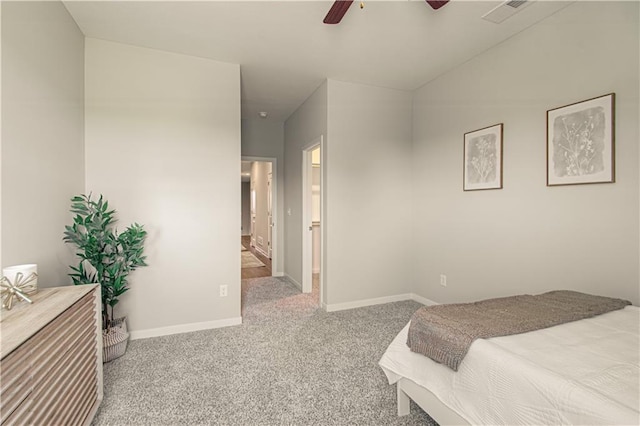 carpeted bedroom featuring ceiling fan and connected bathroom