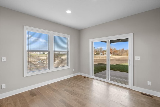 unfurnished room featuring light wood-type flooring