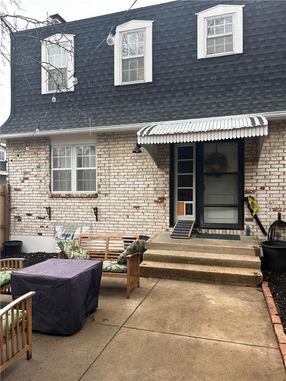 back of house featuring a patio area