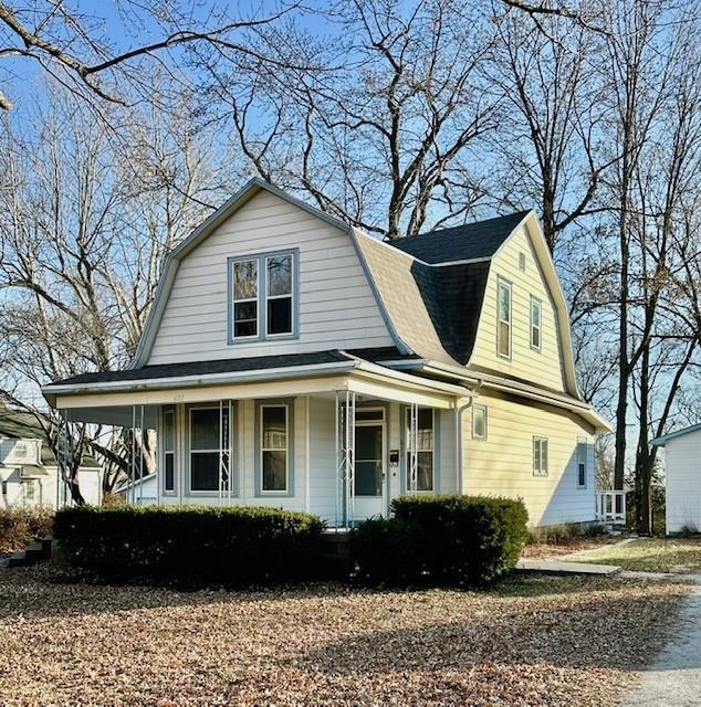 farmhouse inspired home with a porch