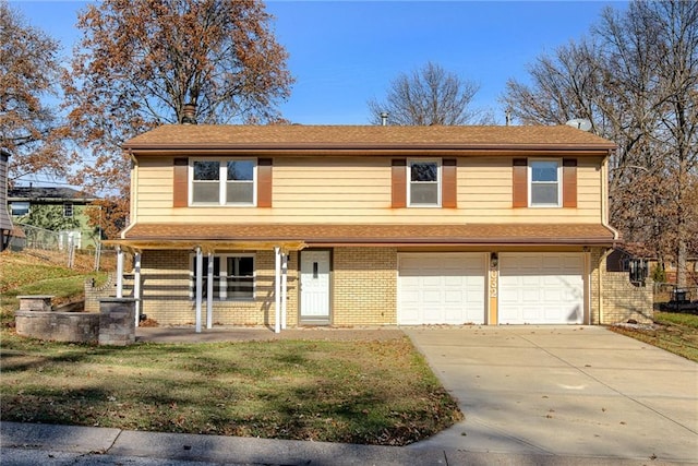 view of front of home featuring a porch, a garage, and a front yard