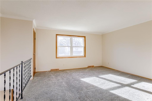 5032 NE 57th Ter, Kansas City, MO 64119 - spare room featuring carpet floors, crown molding, and baseboards