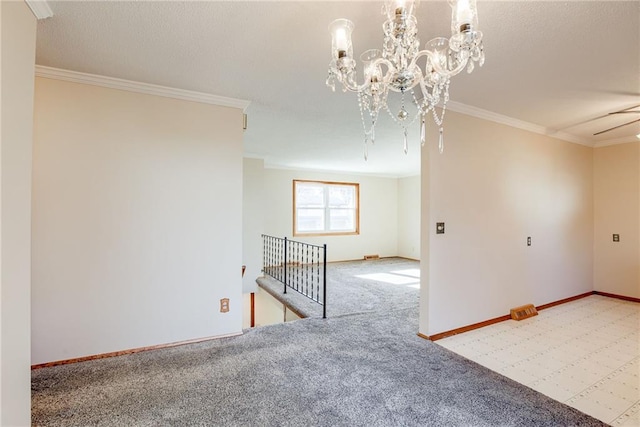 5032 NE 57th Ter, Kansas City, MO 64119 - empty room with ornamental molding, carpet floors, baseboards, and a chandelier