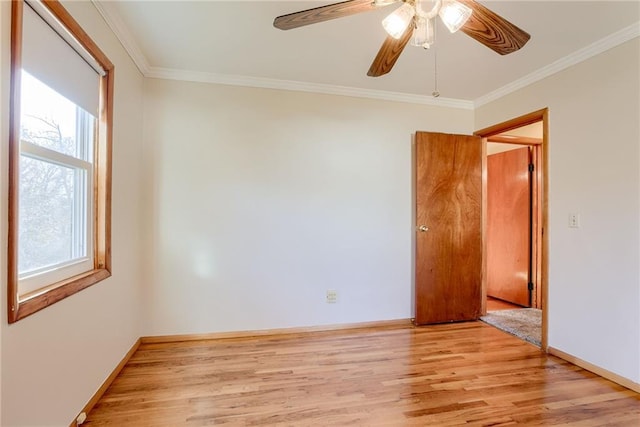 5032 NE 57th Ter, Kansas City, MO 64119 - unfurnished room featuring light wood-style floors, ornamental molding, ceiling fan, and baseboards