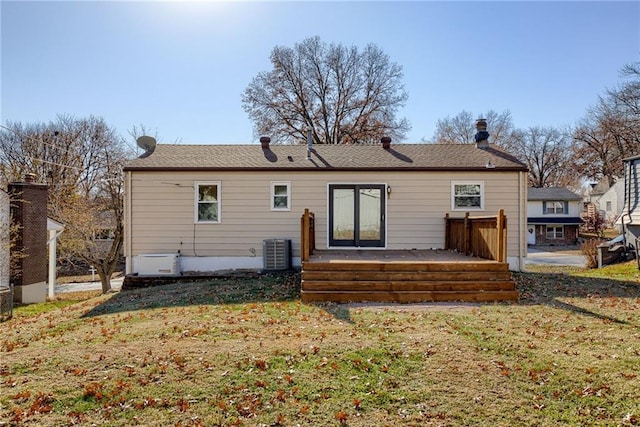 5032 NE 57th Ter, Kansas City, MO 64119 - back of house with central AC, a lawn, and a wooden deck