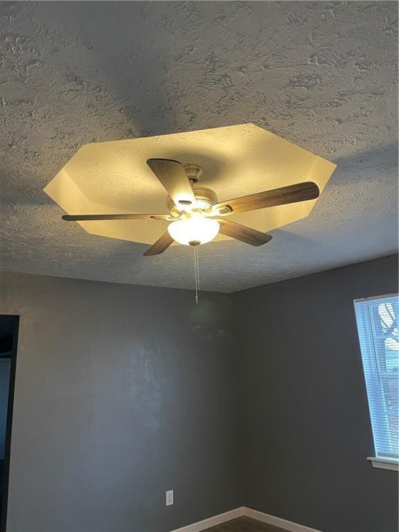 interior details featuring a textured ceiling